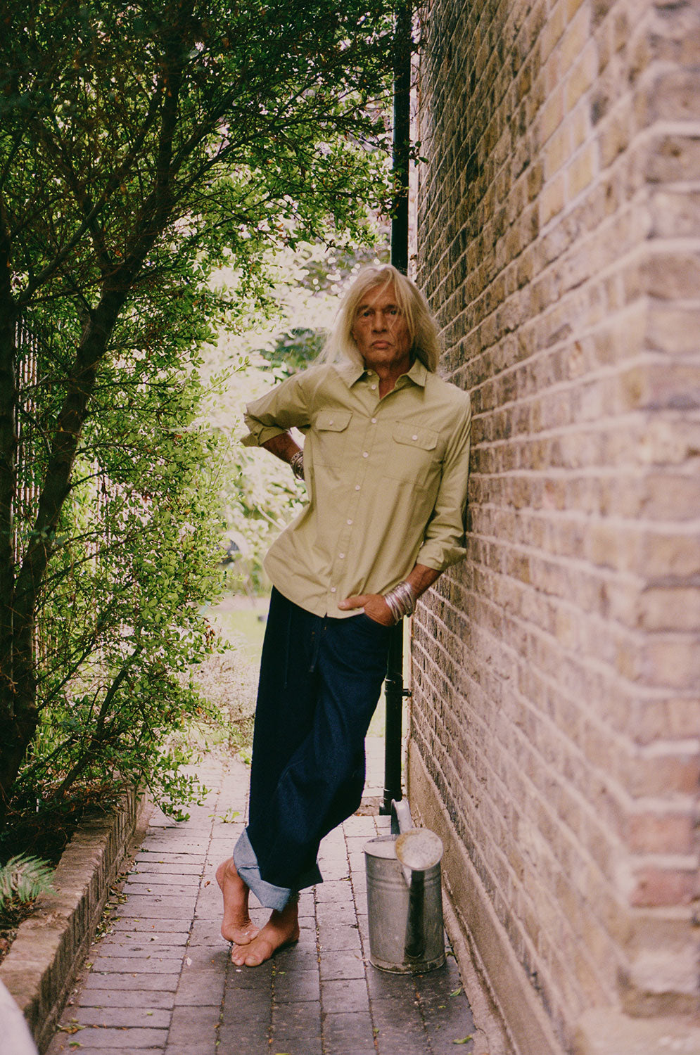 Styling inspiration: Eddy men's khaki utility shirt in heavyweight cotton with patch pockets, made in East London by Saywood. Worn with dark indigo jeans.