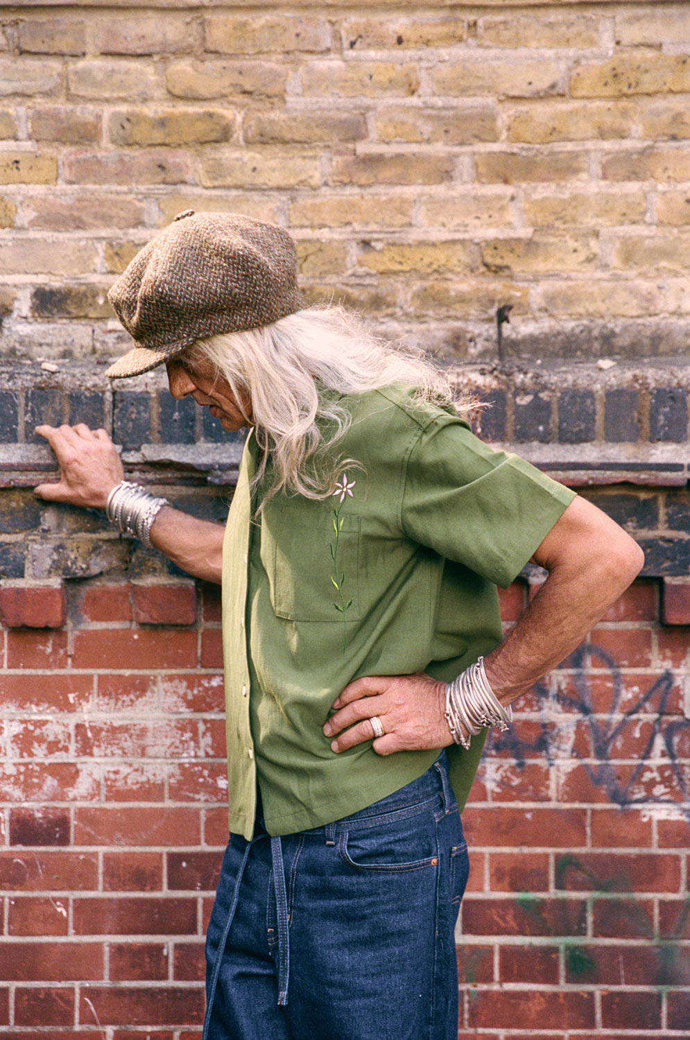Detail of Frances Cuban shirt embroidered flower chest pocket, olive green surplus fabric by Saywood