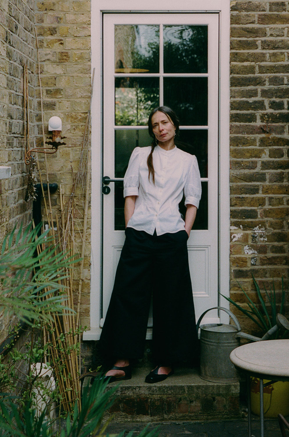 Styling inspiration: Amelia wide leg trousers in black organic cotton and linen with white Joni Blouse, made in London by Saywood