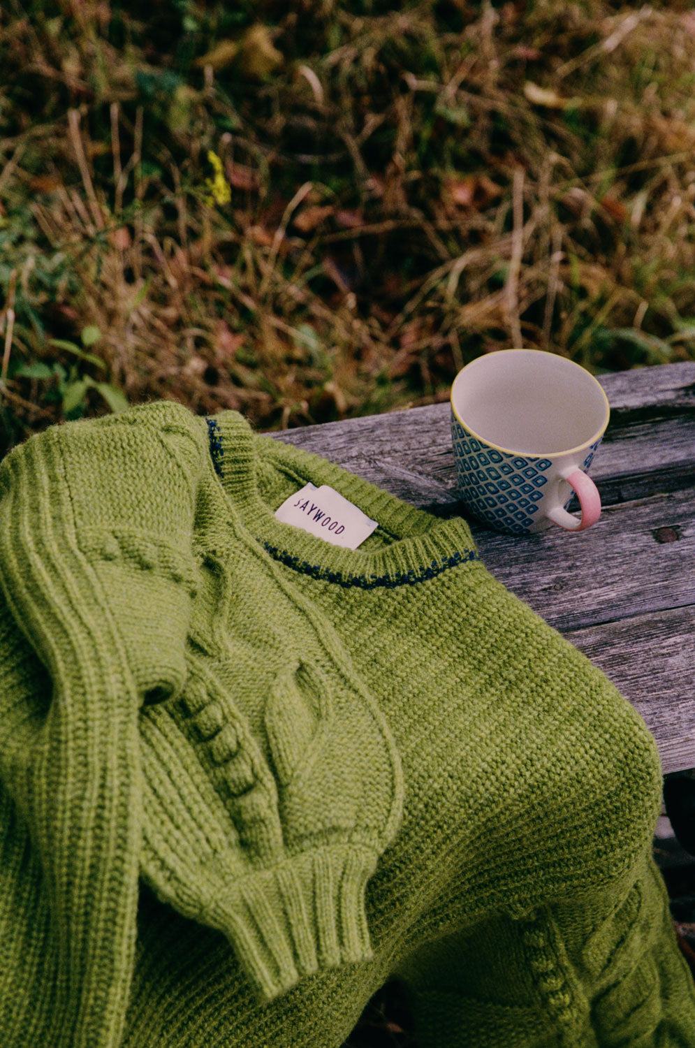 Adams boxy sweater in moss green showing relaxed fit and statement balloon sleeves, fisherman's rib knit, made in the UK