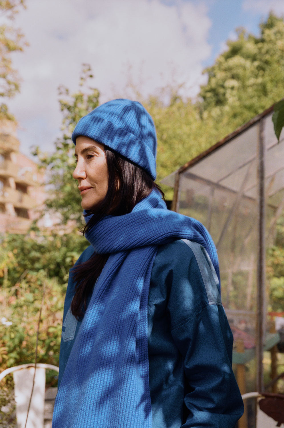 Lela oversized indigo Japanese denim shirt styled with cobalt beanie and scarf