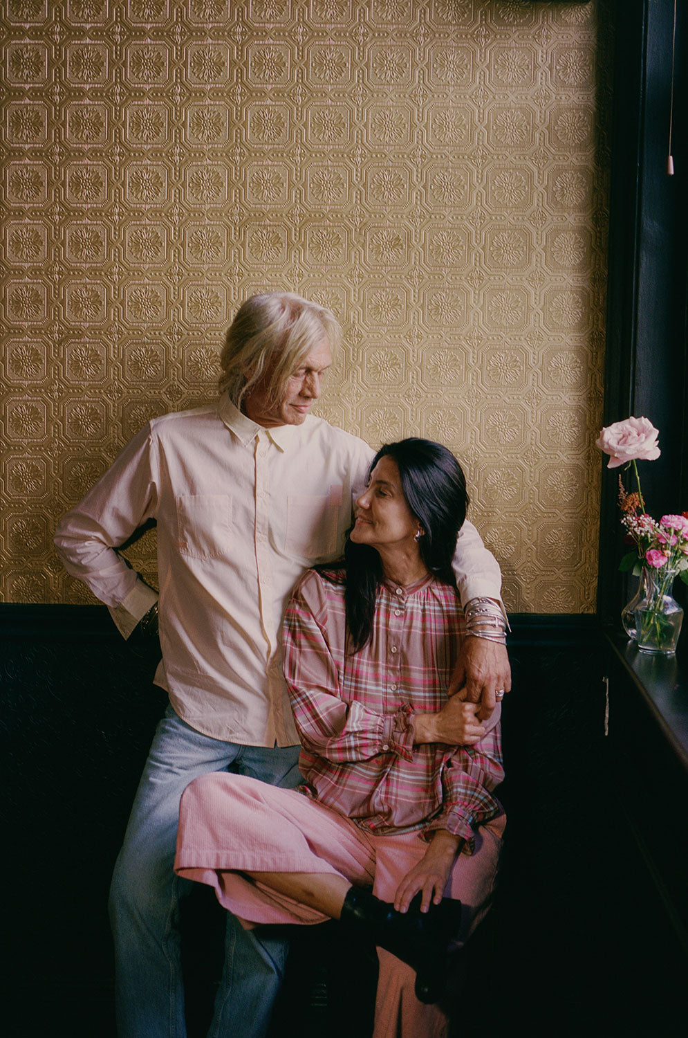 Styling inspiration: Eddy men's orange lemon patchwork shirt, made in London by Saywood. Woman wears Marie pink check blouse and Amelia pink corduroy trousers.